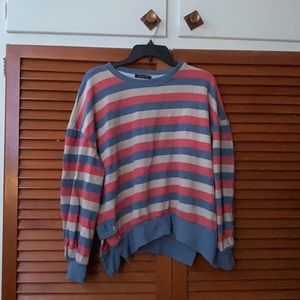 This is a mocha yin jacket that have orange, blue, and yellow stripes